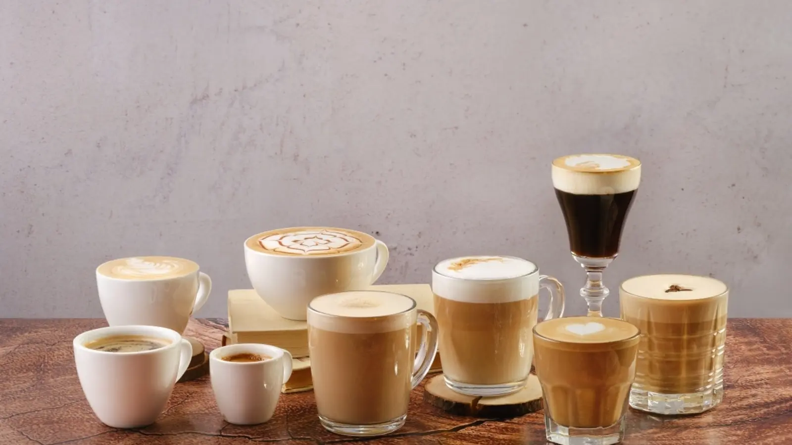 Milk-based coffee drinks served in cups and glasses of different sizes