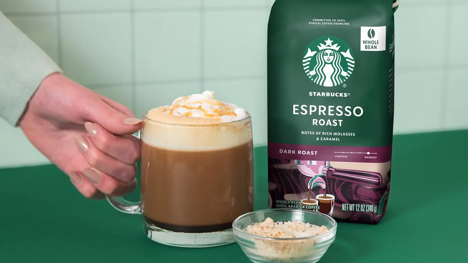 Starbucks Espresso Roast Whole Bean shown in a coffee-serving or brewing setting