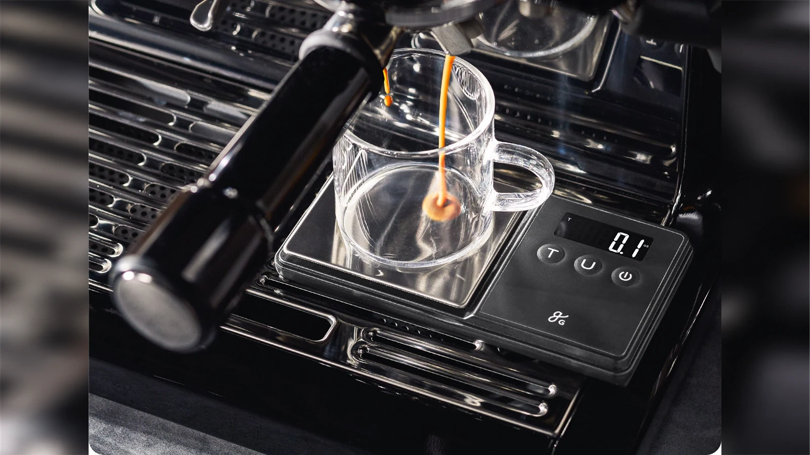 Espresso pouring into a glass on a Greater Goods 750 gram espresso scale