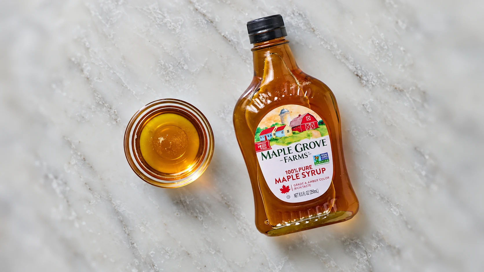 Maple Grove Farms maple syrup with a poured tasting sample