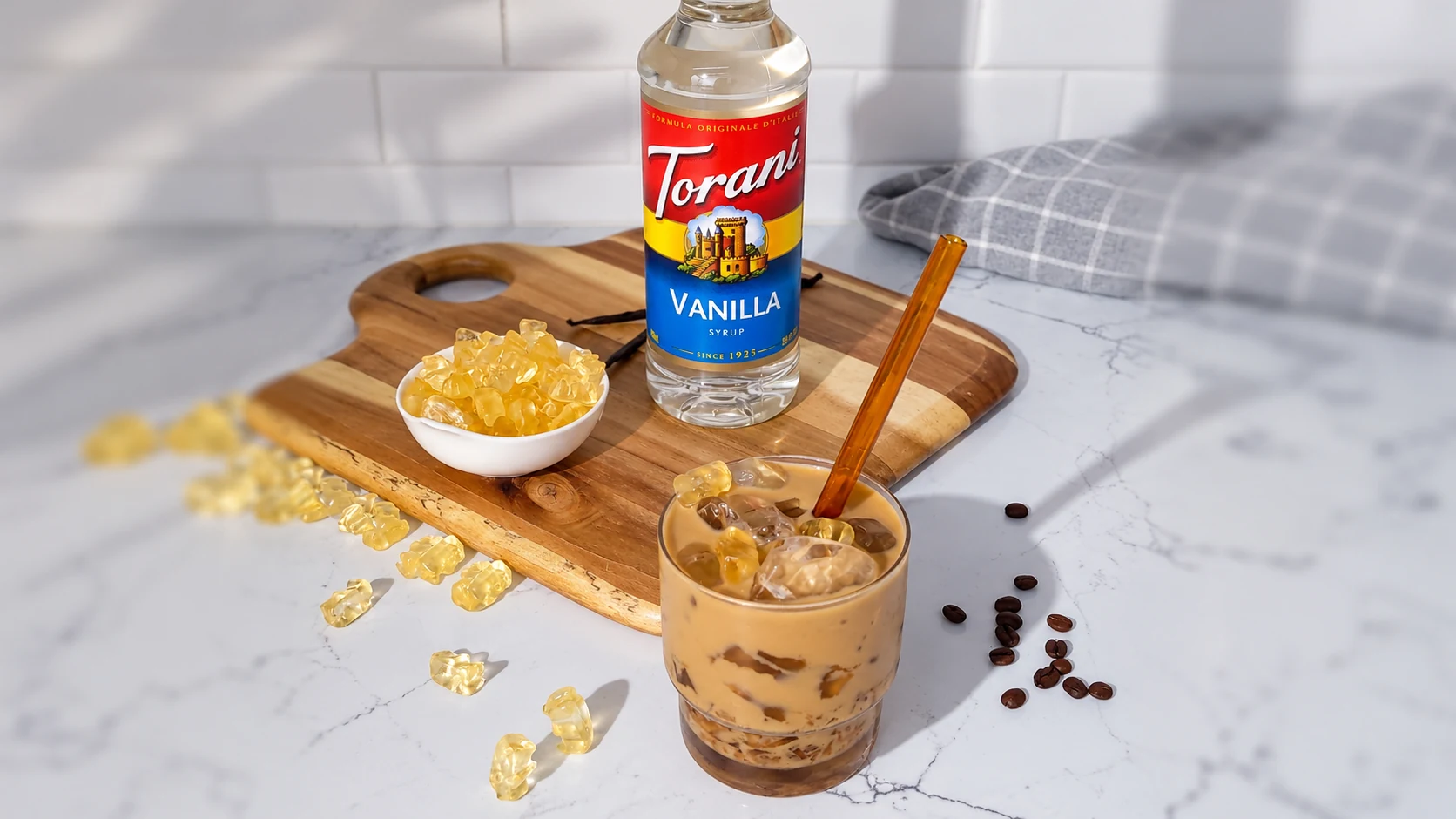 Vanilla syrup, one flavor in the four-bottle set, in Torani’s vanilla jelly coffee serving example. The other three bottles are not pictured.