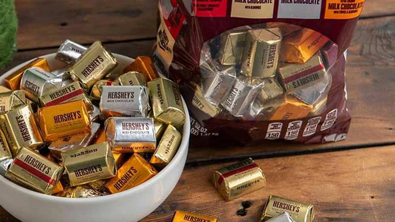 Hershey's Nuggets assortment in a bowl beside the bulk bag