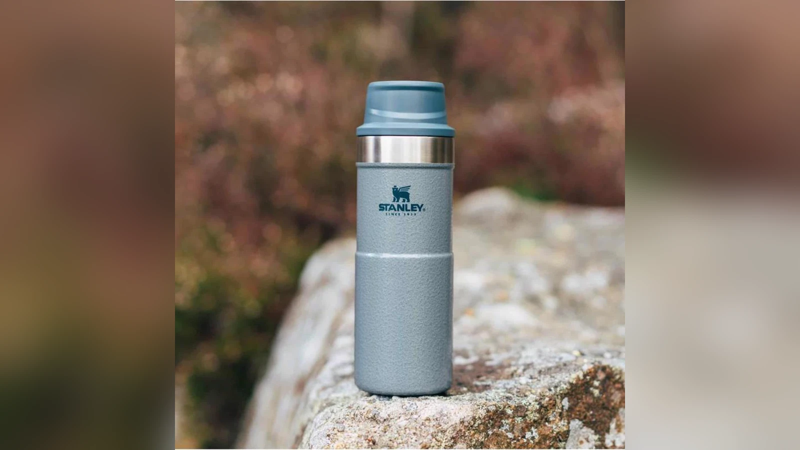 Stanley Classic Trigger Action Travel Mug 16 oz shown in everyday use