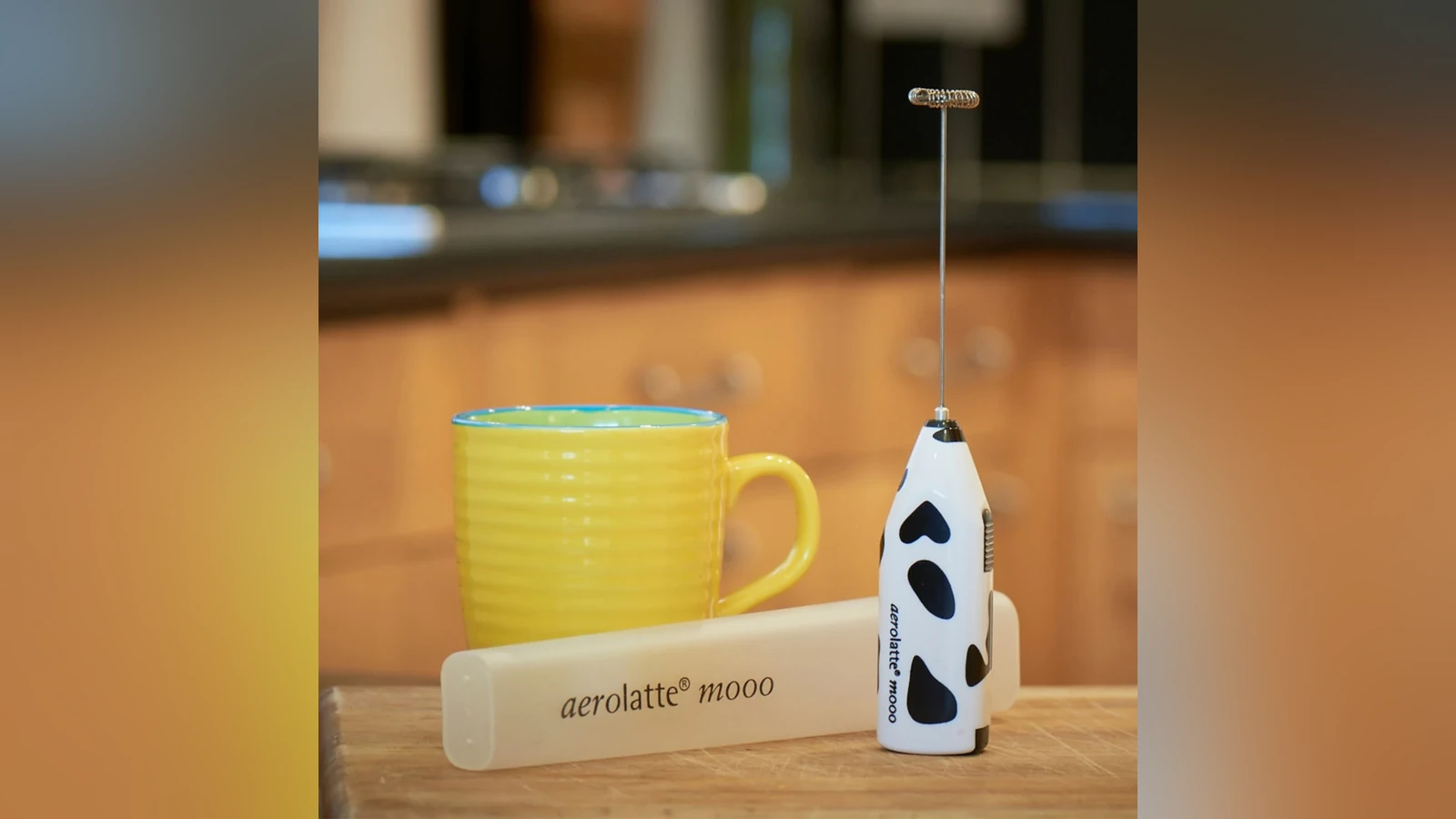 Cow-print Aerolatte Mooo frother with its protective storage case