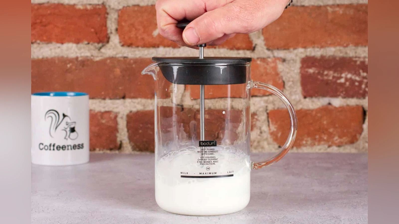 Bodum Latteo glass pitcher being pumped to froth milk