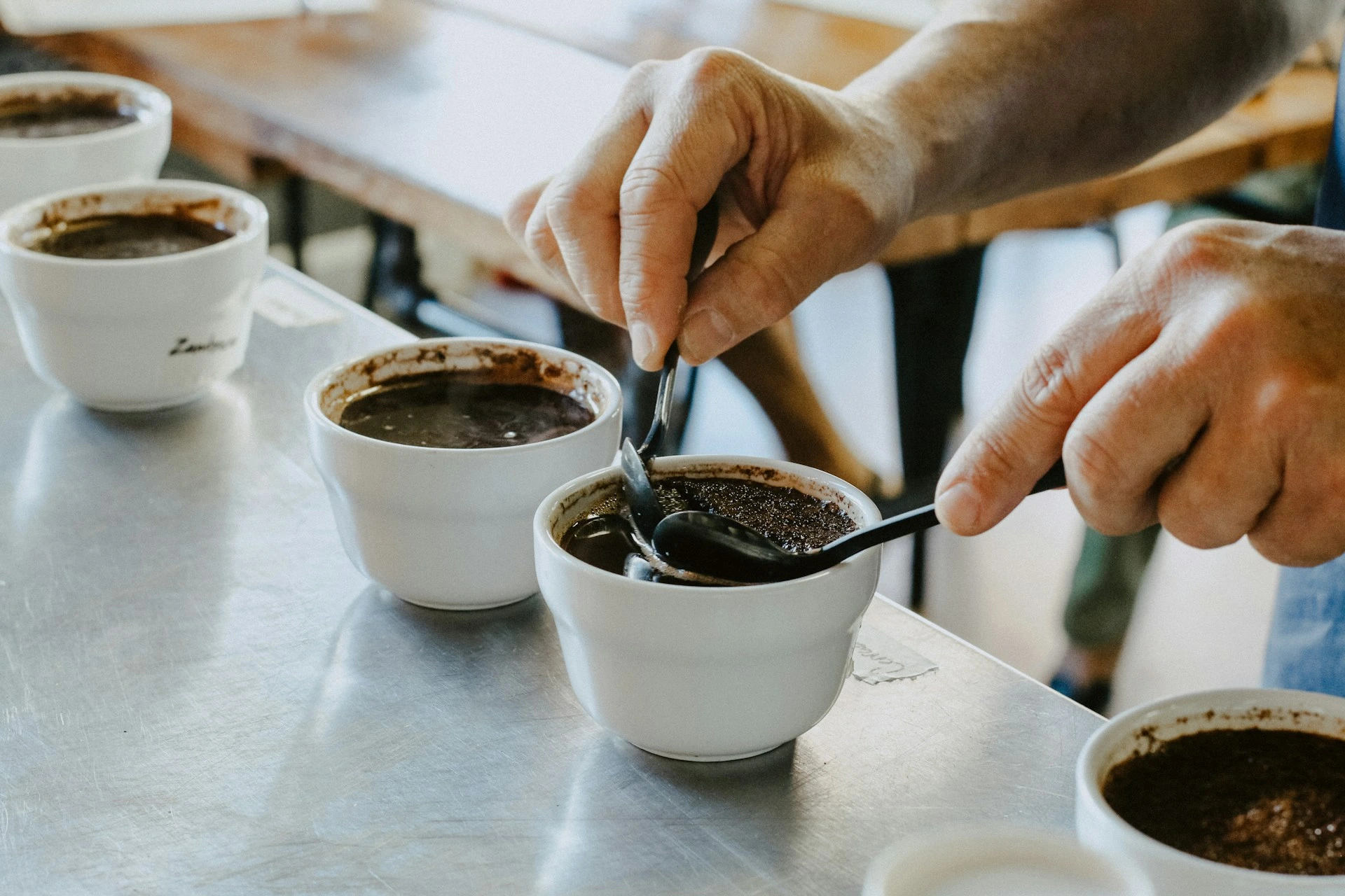 Home barista dialing in espresso with a scale under a cup and a portafilter locked into the group head