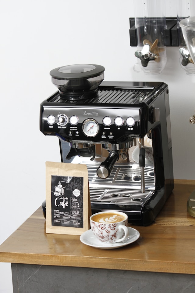 All-in-one espresso machine with built-in grinder on a clean kitchen counter